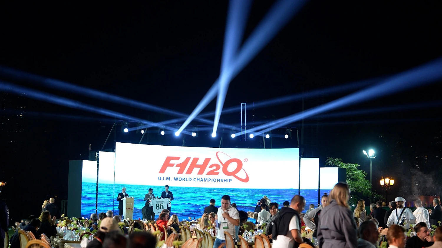 F1H2O UIM World Championship stage with curved LED screen and blue beam lighting at the F1H2O Gala Dinner 2025, Sharjah