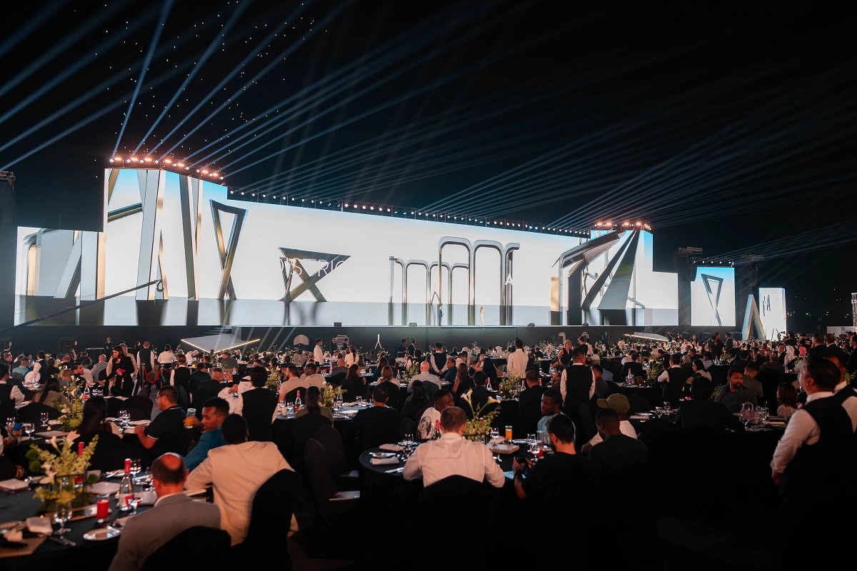 Main stage with giant LED screens and seated VIP guests at the District 11 property launch by Al Marwan Developments, The Meydan Hotel, Dubai