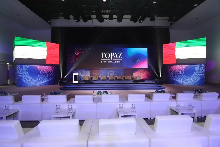 Main conference stage with LED wall and UAE flag screens at the Future Innovation Summit 2022 in Dubai