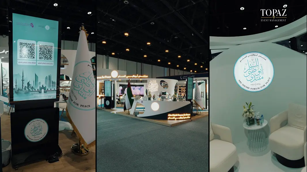 Abu Dhabi Forum for Peace exhibition stand by Topaz Events with digital totem, flags and lounge at the Abu Dhabi International Book Fair