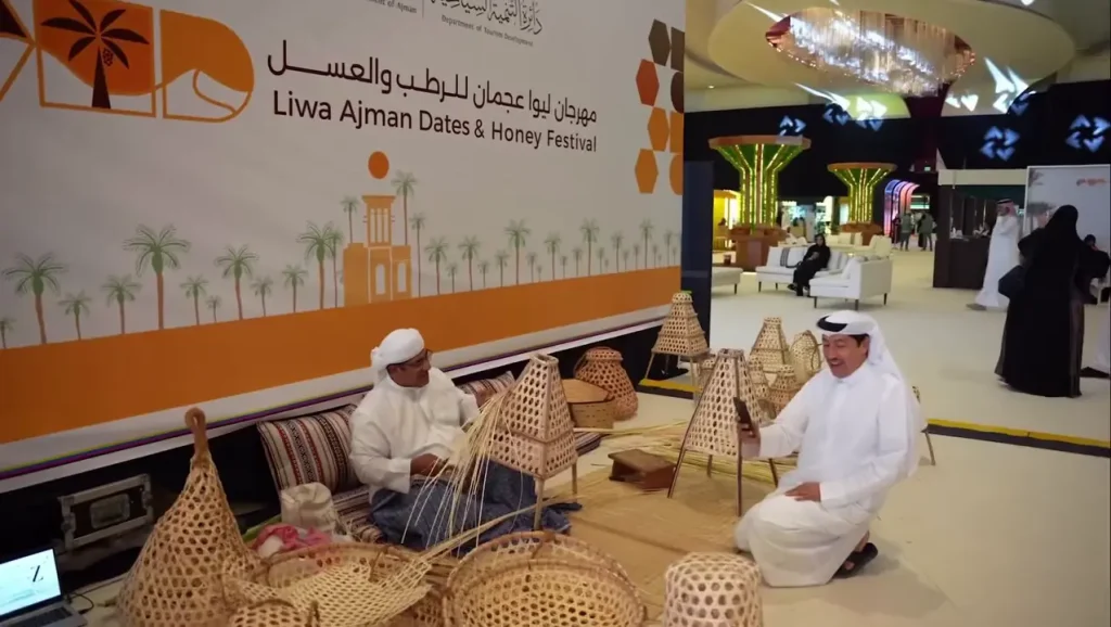 Artisans demonstrating traditional palm-frond weaving at the LIWA Ajman Dates & Honey Festival 2025