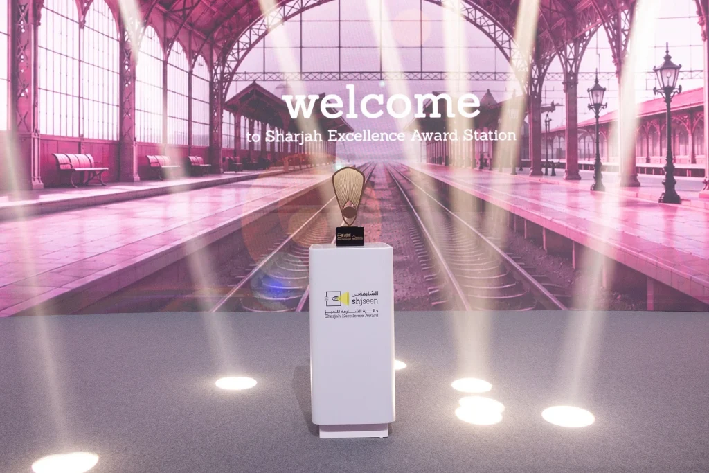 Welcome screen and branded podium on stage before the Shjseen Sharjah Excellence Awards ceremony