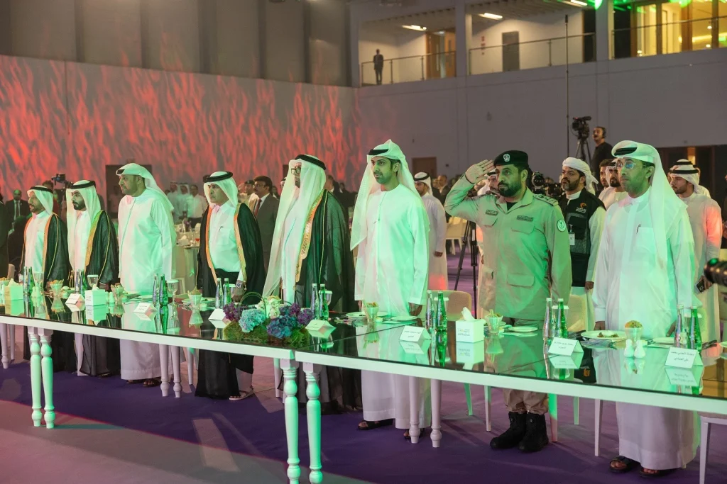 Officials standing at the VIP table during the Shjseen 2026 awards ceremony
