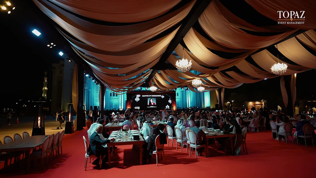 Guests dining beneath the draped canopy with chandeliers at the AUS Ramadan Benefit Suhoor 2025, American University of Sharjah
