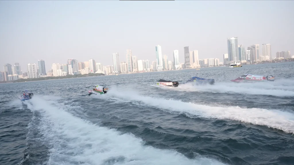 F1H2O powerboats racing in formation off the Sharjah waterfront at the UIM F1H2O World Championship 2024