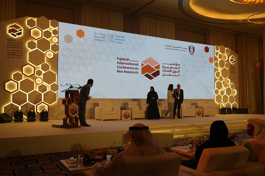 Award presentation on the honeycomb-framed LED stage at the Fujairah International Conference on Bee Research 2023, by Topaz Events