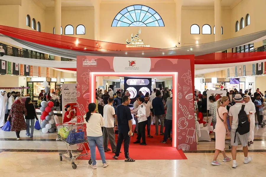Branded red entrance portal and red drapes inside Souq Al Jubail at Sharjah Asset Management’s 15th Anniversary 2024