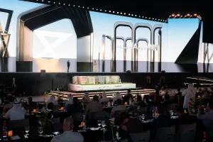 Stage setup at the District 11 Property Launch by Al Marwan Development, organized by Topaz Events, featuring a large LED backdrop, professional lighting, and a modern event stage design for the official real estate launch presentation.