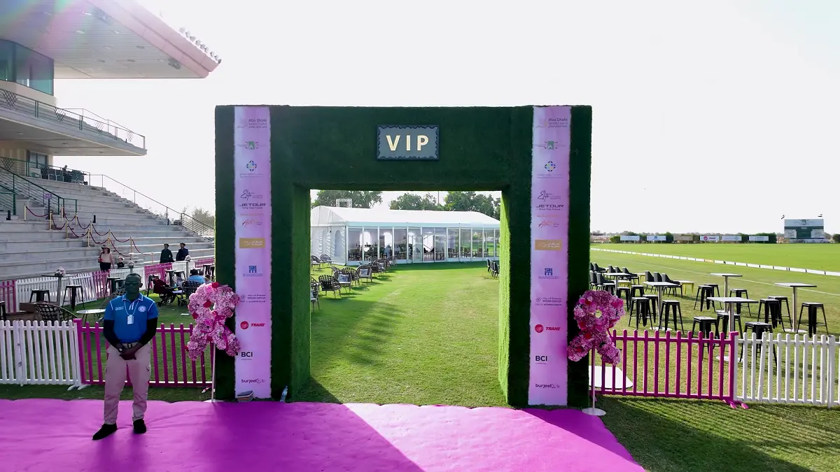 Pink Polo 2025 grand entrance arch featuring Topaz Events branding and pink floral decor at Ghantoot Racing & Polo Club.