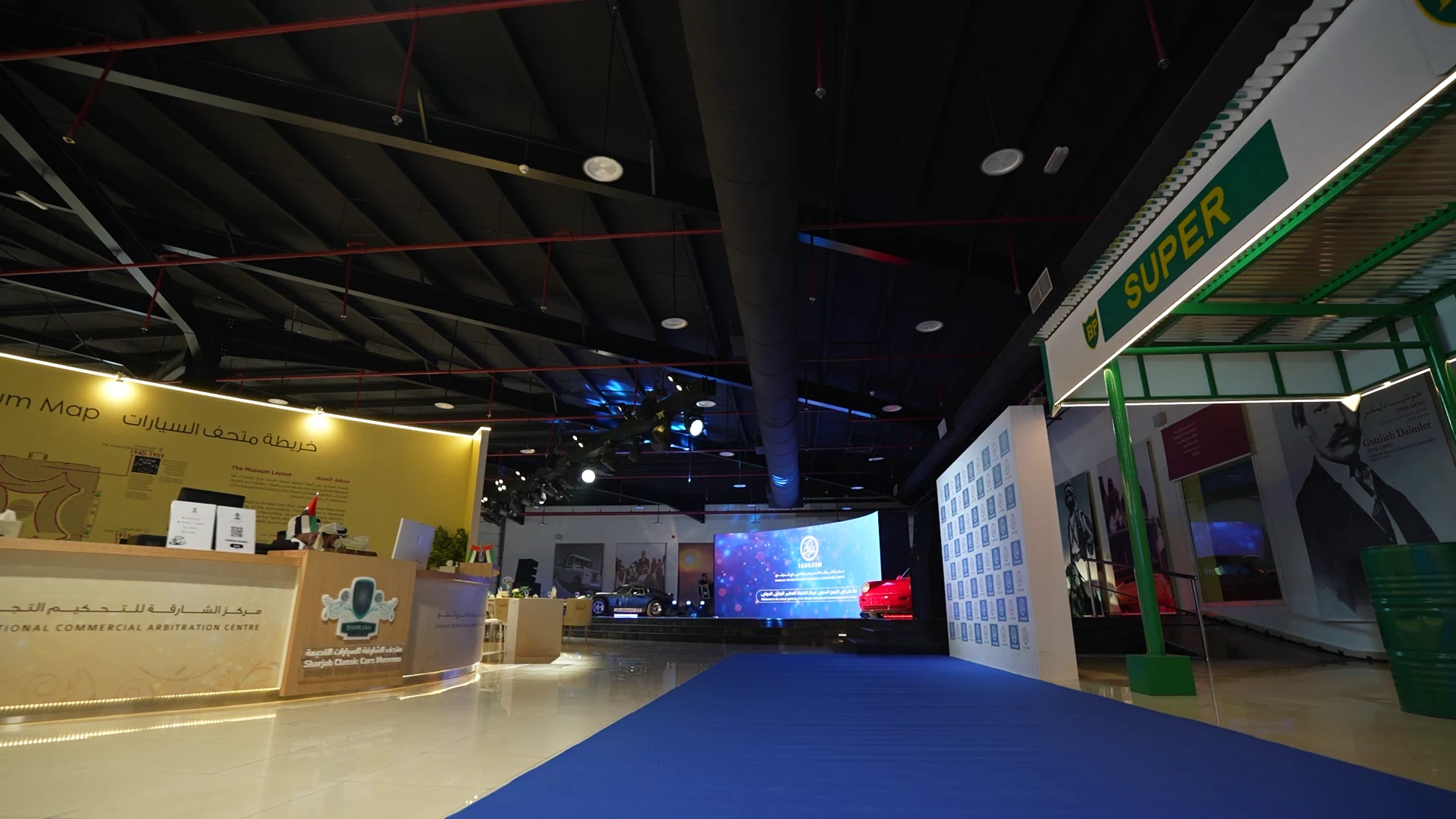 High-definition immersive LED screens displaying classic car visuals during a corporate event at the Sharjah Museum.