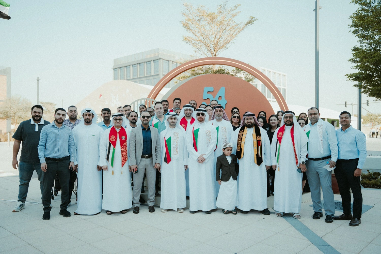 Topaz Events organizing the 54th UAE National Day celebration for Sharjah Asset Management, featuring patriotic décor, stage setup, LED screens, and cultural performances.