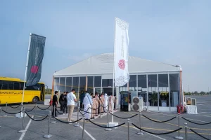 Event registration marquee managed by Topaz Events for the Sheikh Sultan Award, featuring a structured queue system, branded signage, and a temporary outdoor structure.
