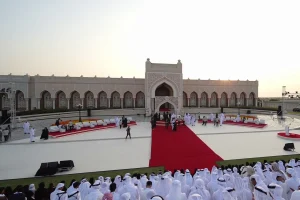 Full event production overview by Topaz Events for the Sheikh Sultan Award, showcasing the complete outdoor stage layout. The setup includes a custom white stage platform, extensive red carpet installation, VIP lounge areas, and truss-mounted lighting rigs, all set against a traditional architectural backdrop