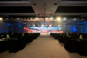 Luxury event seating setup featuring premium white sofas and coffee tables for VIP guests.