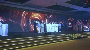 Custom-designed award ceremony stage setup with premium lighting and branding elements