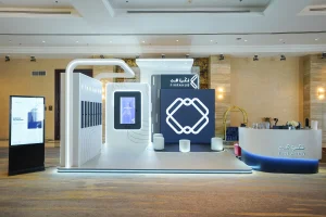 Elegant and futuristic SNOC Fikra Hub stand design executed by Topaz Event Management Agency at Al Jawaher Reception and Convention Centre