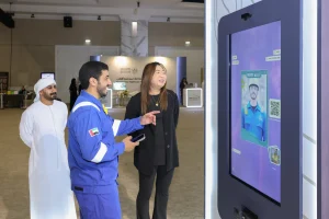 Visitors engaging with the AI Photo Booth activation at the SNOC HSE Expo stand, designed and delivered by Topaz Events to extend brand interaction beyond the exhibition floor at Al Jawaher, Sharjah, April 2026.