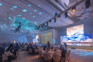 The event hall was transformed with striking stage production, branded visuals, atmospheric lighting and carefully planned layouts.