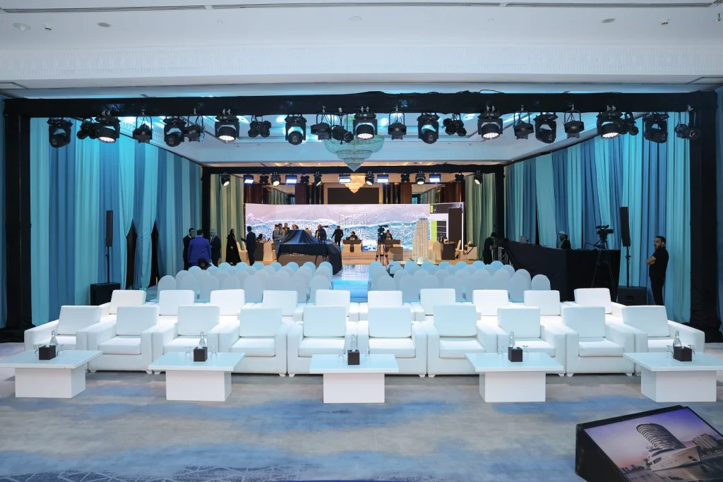 VIP lounge seating facing the LED stage in the main hall at the Aqaar Property Launch Event, Dubai