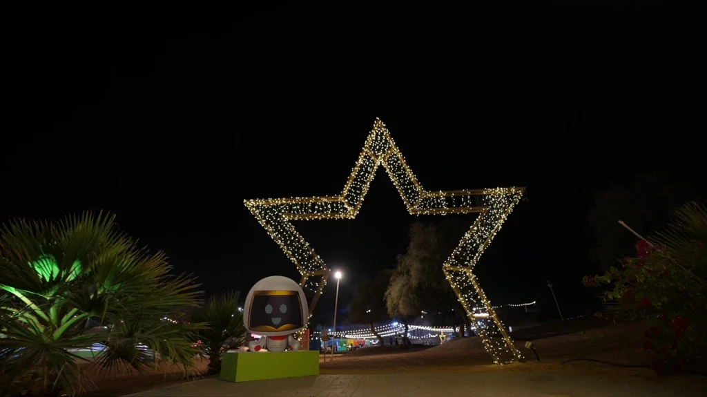 Illuminated star-shaped archway and robot mascot at Aisha Oasis for Innovation 2026