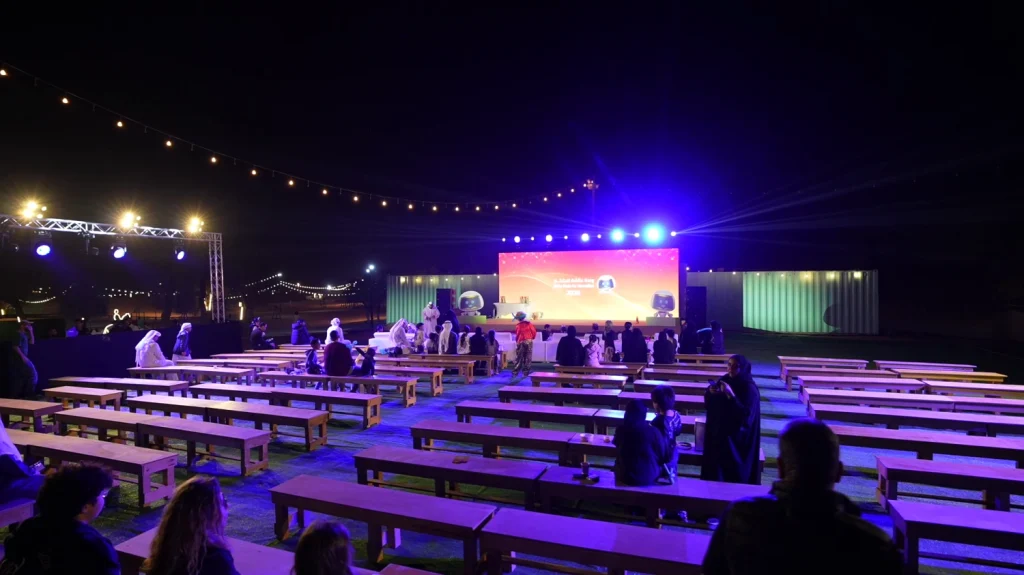 Evening audience seating and stage production at the Aisha Oasis for Innovation 2026 festival