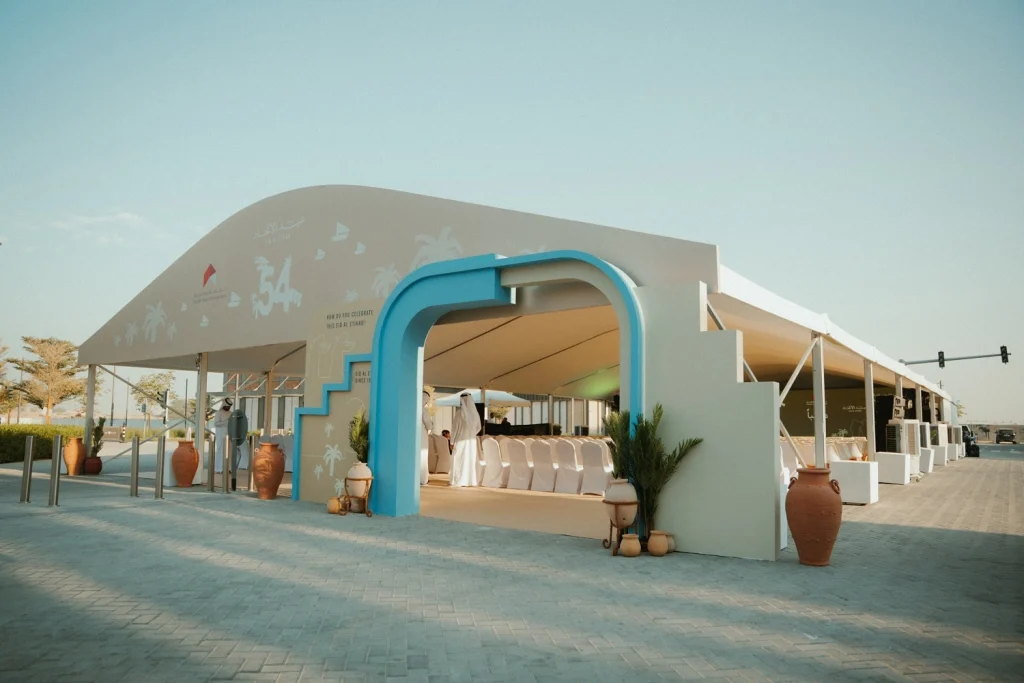 Custom tented venue with a turquoise arched entrance built by Topaz Events for the 54th UAE National Day event, Sharjah