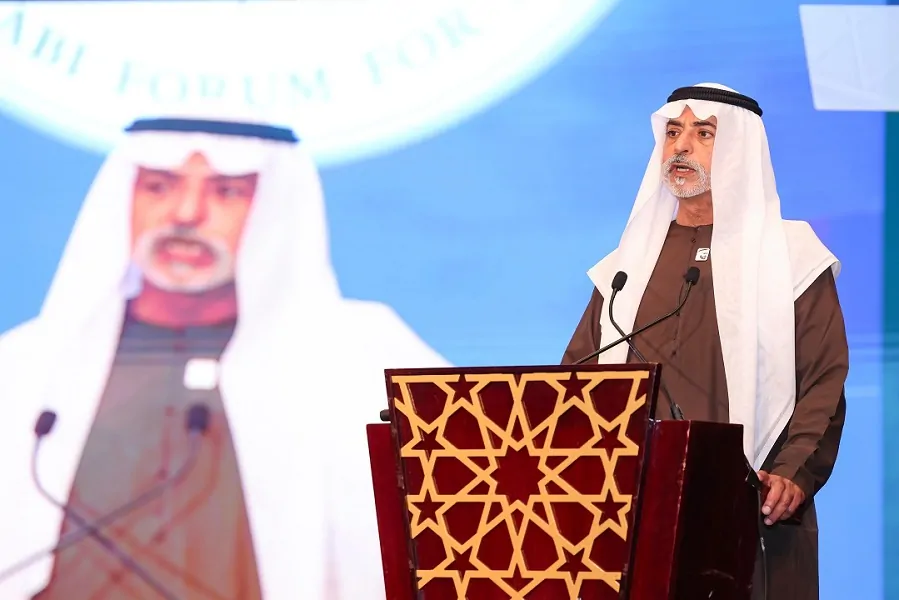 Keynote address at the lectern with live LED screen relay at the Abu Dhabi Forum for Peace National Day celebration