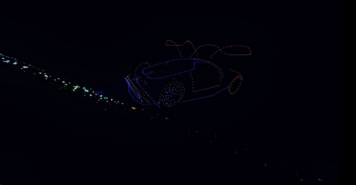 Drone outline of a gull-wing car with light trail at the Binghatti X Mercedes Drone Show 2024
