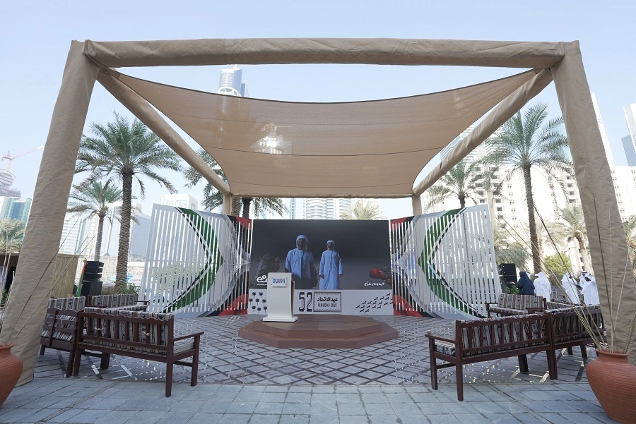Shaded sail-canopy stage with LED screen and 52nd National Day branding at the Dubai World Trade Centre celebration by Topaz Events